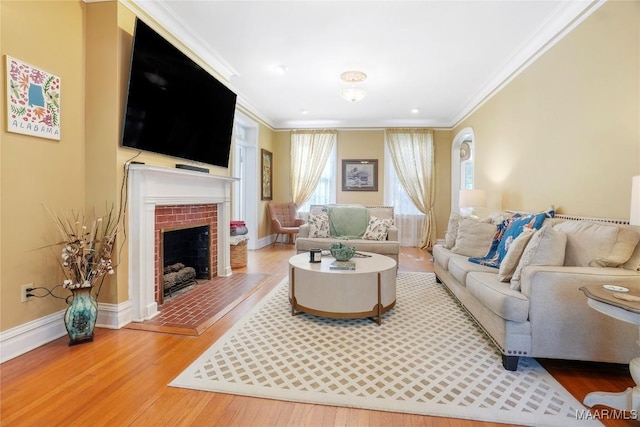 100 S Franklin Ave, Luverne, AL 36049 - living area with baseboards, ornamental molding, a fireplace with raised hearth, and wood finished floors