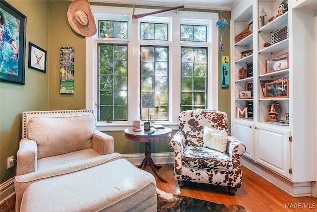 100 S Franklin Ave, Luverne, AL 36049 - living area featuring crown molding, baseboards, and wood finished floors