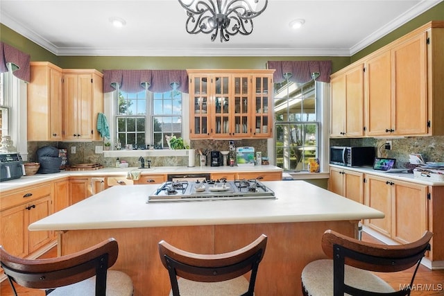 100 S Franklin Ave, Luverne, AL 36049 - kitchen with an inviting chandelier, light countertops, appliances with stainless steel finishes, and tasteful backsplash