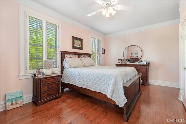 100 S Franklin Ave, Luverne, AL 36049 - bedroom with baseboards, ornamental molding, ceiling fan, and hardwood / wood-style flooring