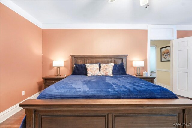 100 S Franklin Ave, Luverne, AL 36049 - bedroom featuring baseboards and wood finished floors
