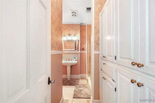 100 S Franklin Ave, Luverne, AL 36049 - bathroom with a sink, tile patterned floors, and visible vents