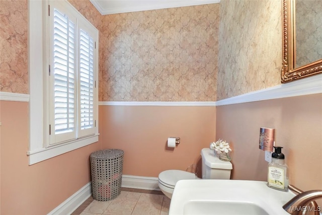 100 S Franklin Ave, Luverne, AL 36049 - bathroom featuring a sink, baseboards, tile patterned floors, and toilet