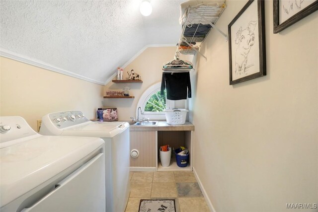 100 S Franklin Ave, Luverne, AL 36049 - laundry area featuring a textured ceiling, laundry area, washing machine and dryer, and a sink