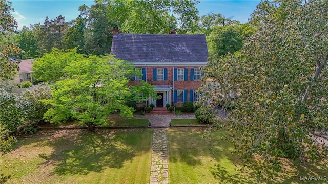 100 S Franklin Ave, Luverne, AL 36049 - colonial-style house featuring a chimney and brick siding