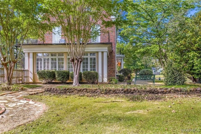 100 S Franklin Ave, Luverne, AL 36049 - view of property exterior featuring a lawn and fence