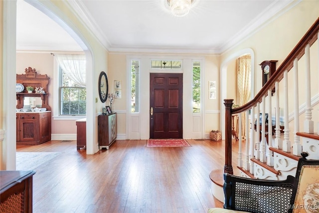 100 S Franklin Ave, Luverne, AL 36049 - entryway featuring crown molding, arched walkways, and light wood finished floors