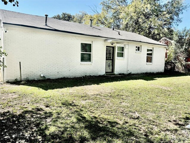 644 Iris Ln, Montgomery, AL 36105 - view of front of home featuring brick siding and a front yard