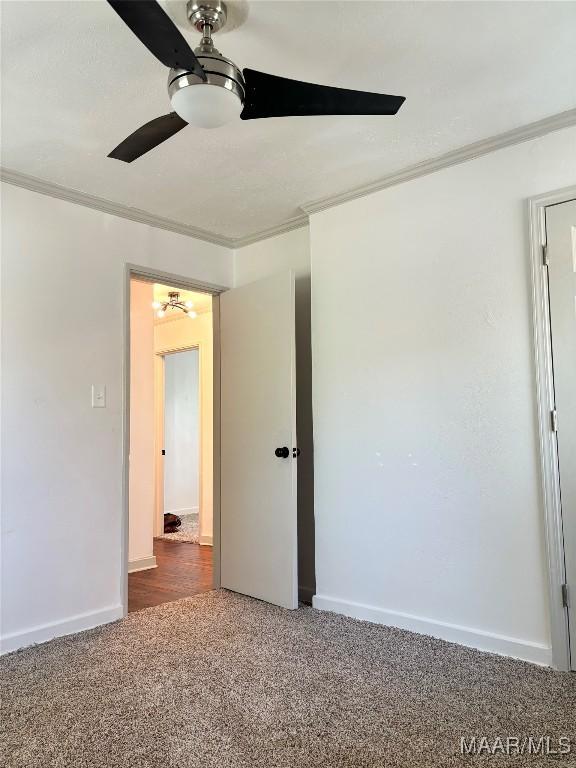 644 Iris Ln, Montgomery, AL 36105 - carpeted empty room with ornamental molding, ceiling fan, and baseboards
