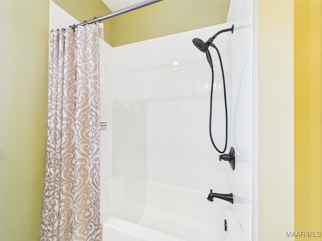 bathroom featuring shower / bath combo with shower curtain