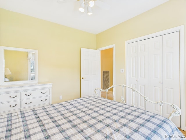 bedroom featuring a closet, visible vents, and ceiling fan