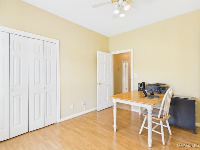 office with ceiling fan, wood finished floors, and baseboards