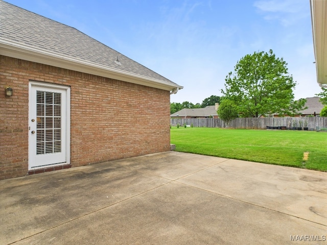 view of patio / terrace featuring fence