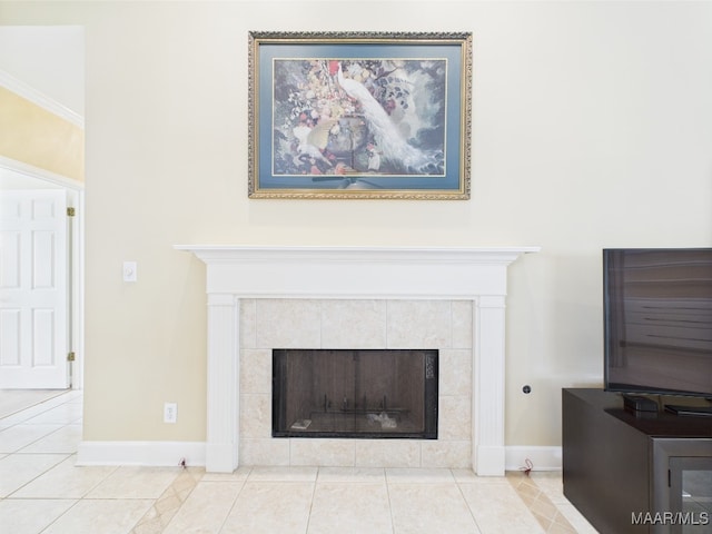 room details featuring baseboards and a fireplace