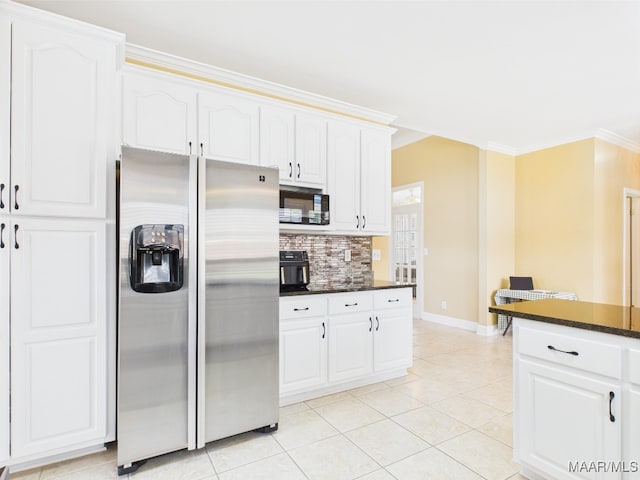 kitchen with decorative backsplash, light tile patterned floors, stainless steel fridge, ornamental molding, and baseboards