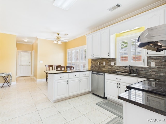 kitchen with dishwasher, a sink, visible vents, a peninsula, and crown molding