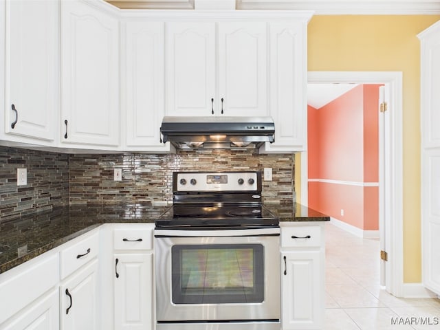 kitchen featuring decorative backsplash, light tile patterned floors, range hood, white cabinetry, and stainless steel range with electric stovetop