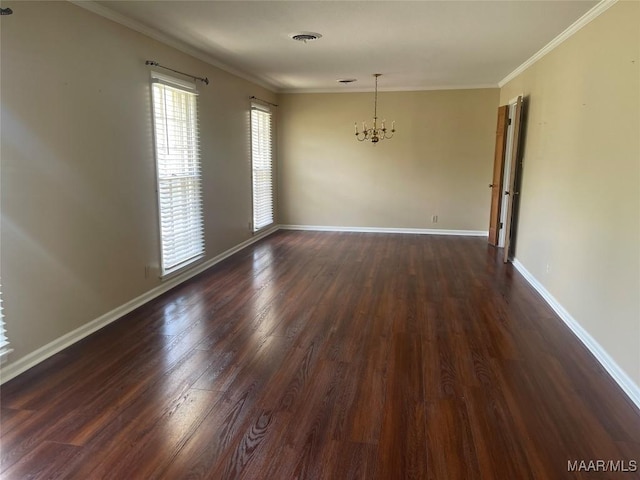3244 Cheltenham Dr, Montgomery, AL 36116 - spare room featuring ornamental molding, a notable chandelier, dark wood finished floors, and baseboards