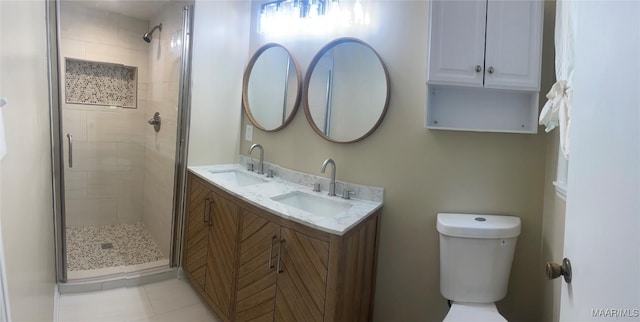 3244 Cheltenham Dr, Montgomery, AL 36116 - bathroom featuring a shower stall, toilet, double vanity, and a sink