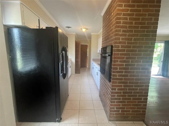 3244 Cheltenham Dr, Montgomery, AL 36116 - kitchen featuring white cabinetry, light tile patterned floors, black appliances, and crown molding