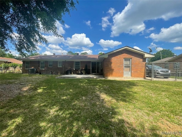 3244 Cheltenham Dr, Montgomery, AL 36116 - back of house with fence, a yard, central air condition unit, and brick siding