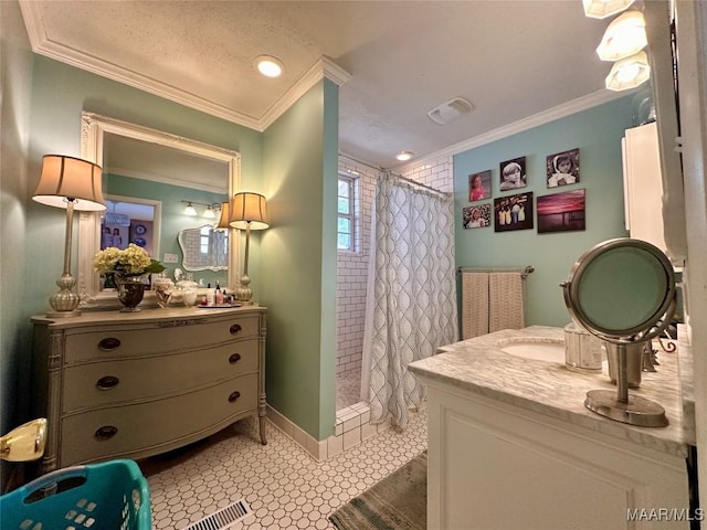 full bathroom featuring crown molding, a shower stall, and vanity