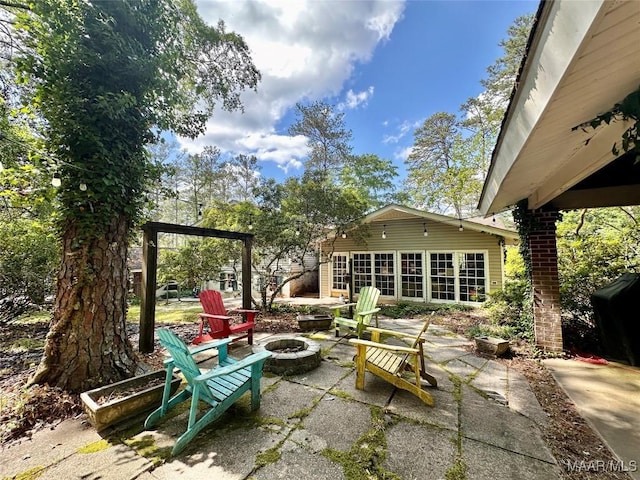 view of patio / terrace with a fire pit