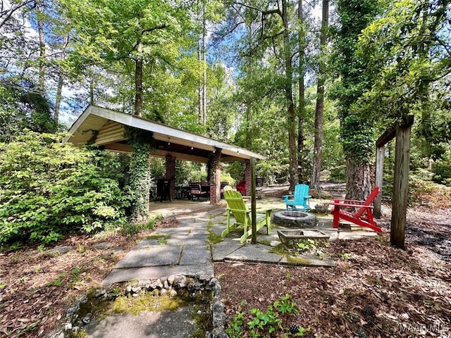 view of yard with a patio, an outdoor fire pit, and a gazebo