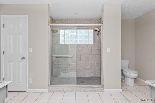 733 Cartwright Rd, Titus, AL 36080 - full bathroom with vanity, toilet, a stall shower, and baseboards