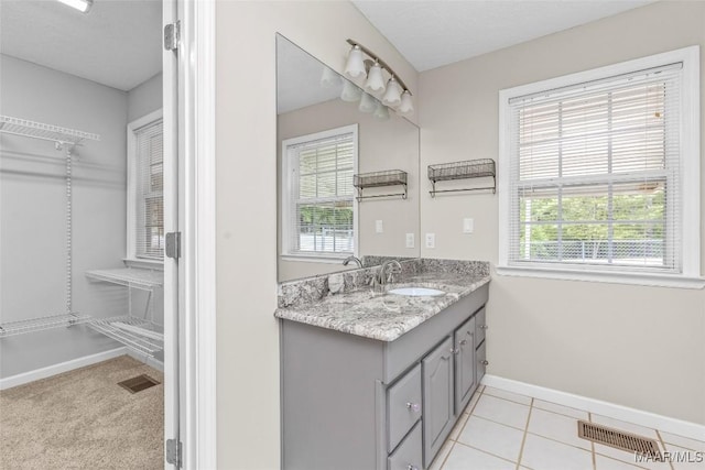 733 Cartwright Rd, Titus, AL 36080 - bathroom with visible vents, vanity, tile patterned flooring, and baseboards