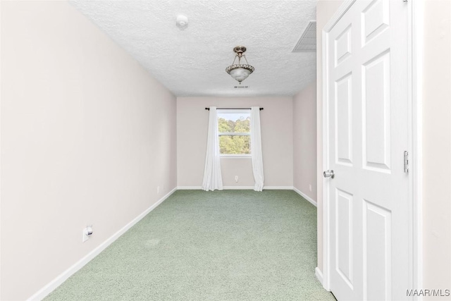 733 Cartwright Rd, Titus, AL 36080 - empty room featuring a textured ceiling, visible vents, light carpet, and baseboards