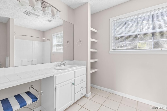 733 Cartwright Rd, Titus, AL 36080 - full bath featuring tile patterned floors, visible vents, a textured ceiling, and vanity