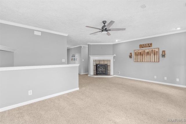 733 Cartwright Rd, Titus, AL 36080 - unfurnished living room with a tile fireplace, ceiling fan, baseboards, ornamental molding, and a textured ceiling
