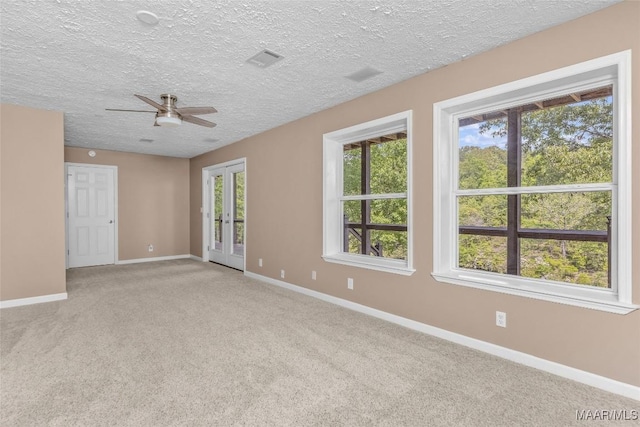 733 Cartwright Rd, Titus, AL 36080 - unfurnished room with visible vents, baseboards, a ceiling fan, and light carpet