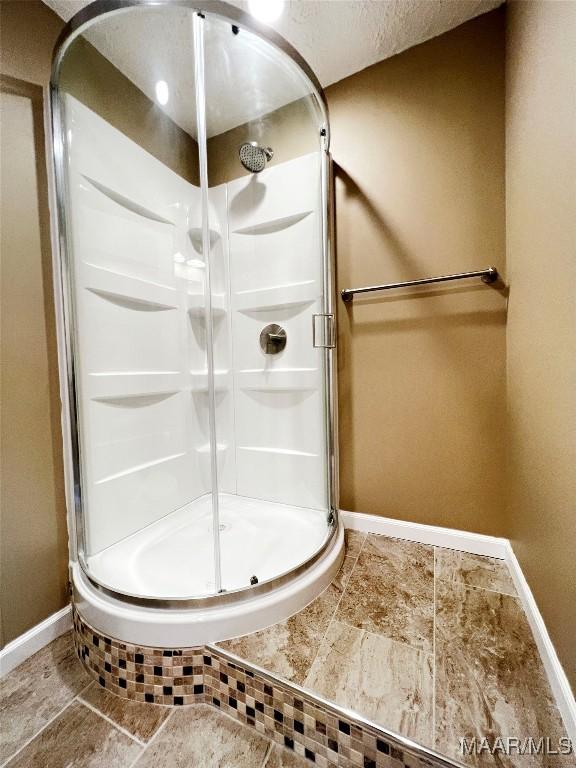 733 Cartwright Rd, Titus, AL 36080 - bathroom with baseboards and a stall shower