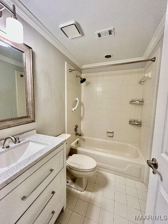 bathroom featuring vanity, tile patterned floors, toilet, visible vents, and ornamental molding