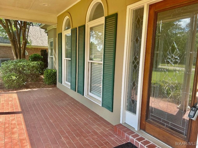 property entrance featuring covered porch