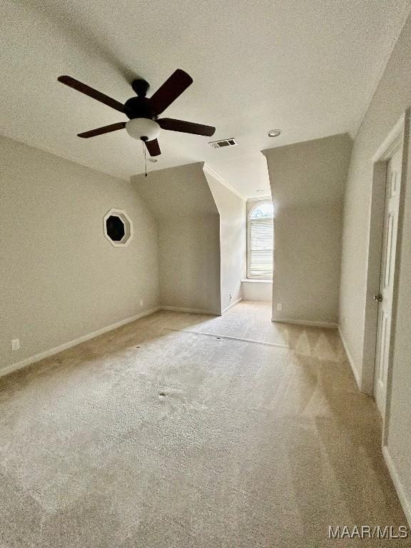 bonus room featuring visible vents, a ceiling fan, a textured ceiling, and carpet