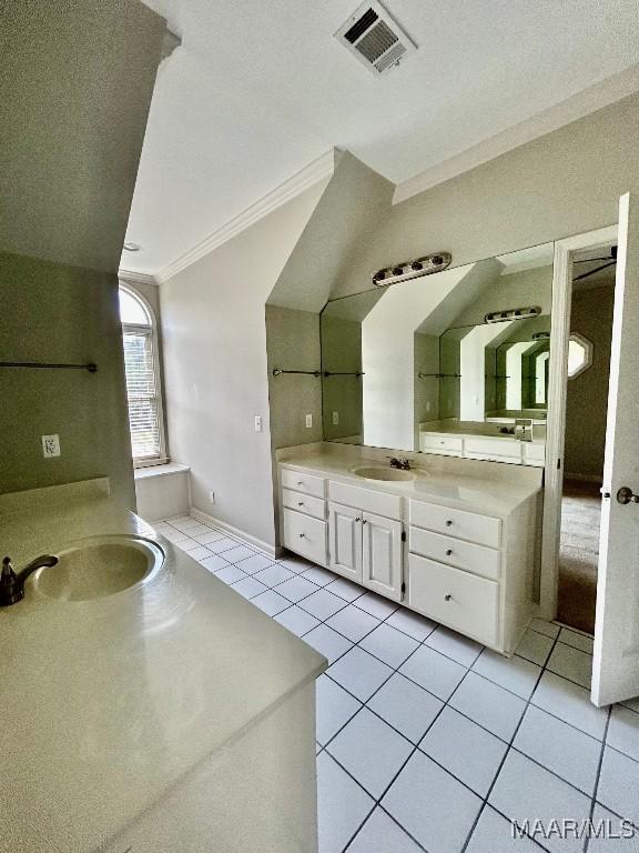 full bath featuring crown molding, a sink, visible vents, two vanities, and tile patterned floors