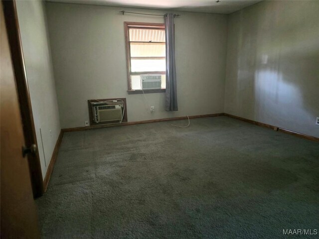 2724 Crestview Ave, Montgomery, AL 36109 - spare room featuring carpet, a wall mounted air conditioner, and baseboards
