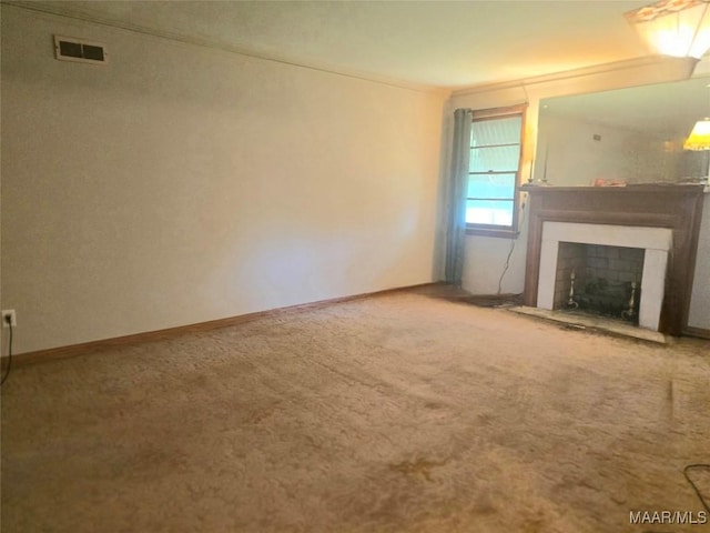 2724 Crestview Ave, Montgomery, AL 36109 - unfurnished living room with carpet flooring, visible vents, a fireplace, and baseboards