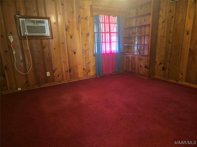2724 Crestview Ave, Montgomery, AL 36109 - carpeted spare room featuring wood walls and a wall mounted air conditioner