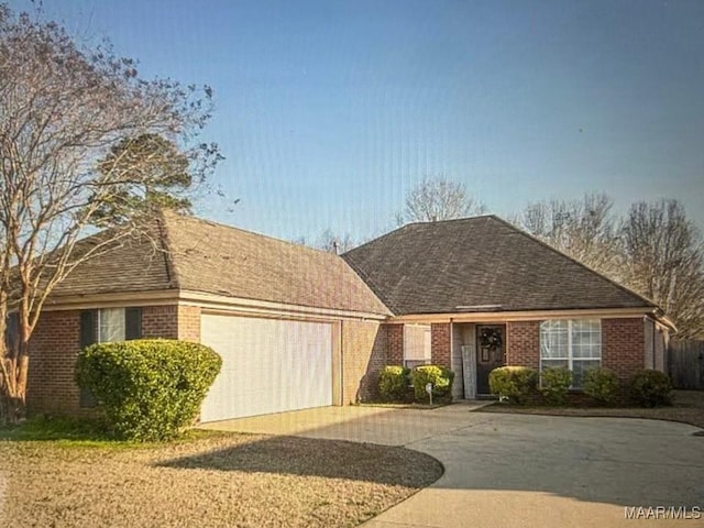 7648 Steele Ridge Dr, Montgomery, AL 36117 - ranch-style home featuring a garage, driveway, and brick siding