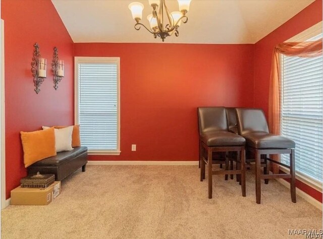 7648 Steele Ridge Dr, Montgomery, AL 36117 - sitting room featuring lofted ceiling, a chandelier, baseboards, and carpet flooring