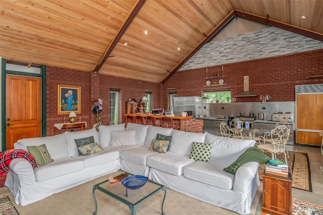 living room with wood ceiling, brick wall, and high vaulted ceiling