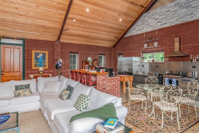 living room featuring high vaulted ceiling, brick wall, and wood ceiling