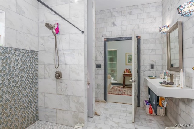 bathroom with a tile shower