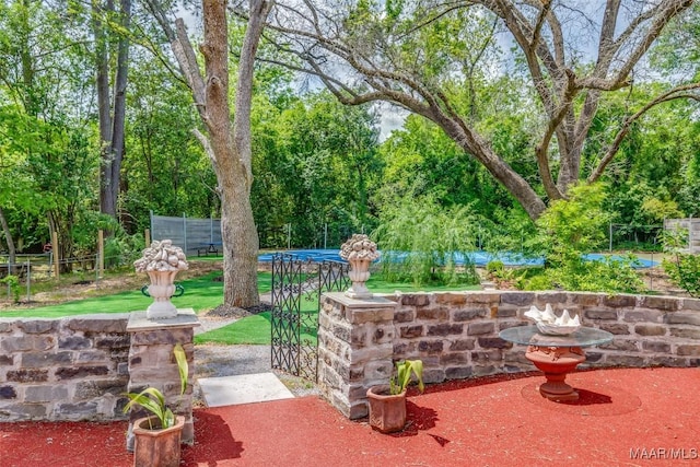 view of patio featuring fence