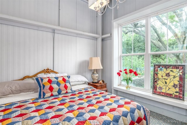 bedroom with multiple windows