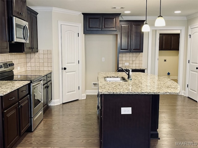 kitchen featuring stainless steel appliances, crown molding, dark wood-type flooring, and a sink